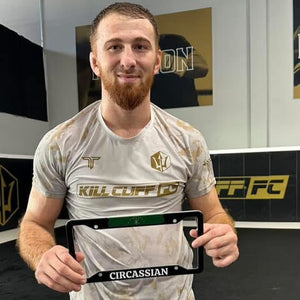 Muhammad Berkhamov MMA Fighter holding frame from Cultics