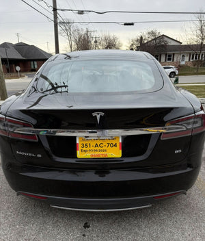 ossetian flag license plate frame on black tesla